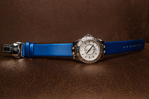 Ladies automatic watch with a blue silk bracelet, a high quality 40h power reserve movement and beautiful coloured zircon stones on the dial.