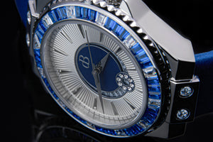 Ladies automatic watch with a blue silk bracelet, a high quality 40h power reserve movement and beautiful coloured zircon stones on the dial.