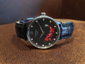 A noble Quarz watch designed with a red Koi fish. Made with a black genuine leather bracelet, a stainless steel body and a Swiss ronda movement.